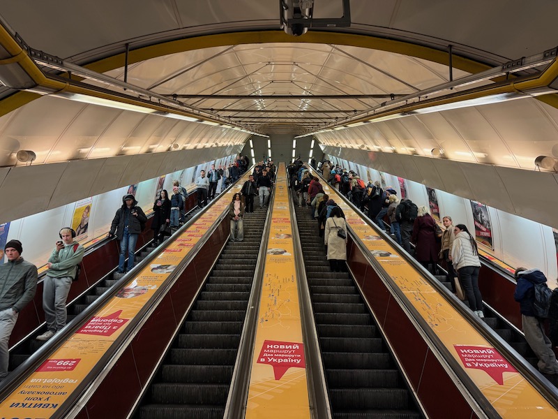 a group of people on an escalator