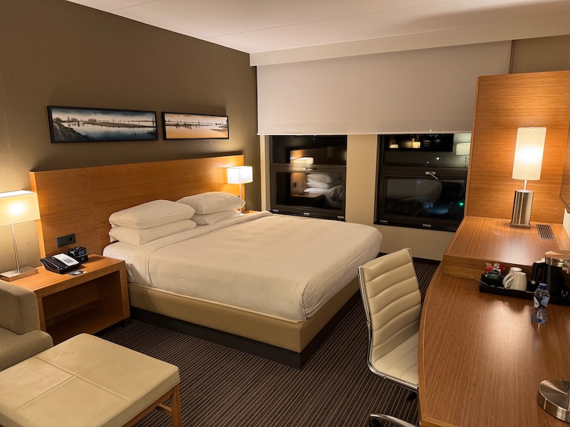 a room with a bed and desk