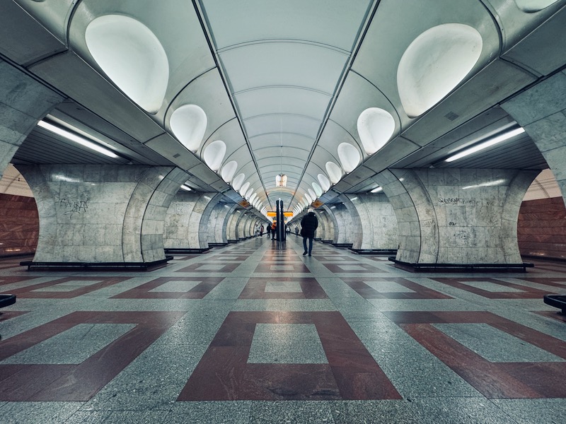 people walking in a tunnel