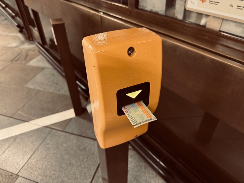 a ticket dispenser with money in it