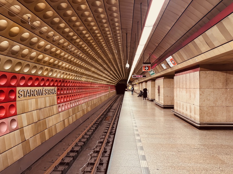 a train station with a tunnel
