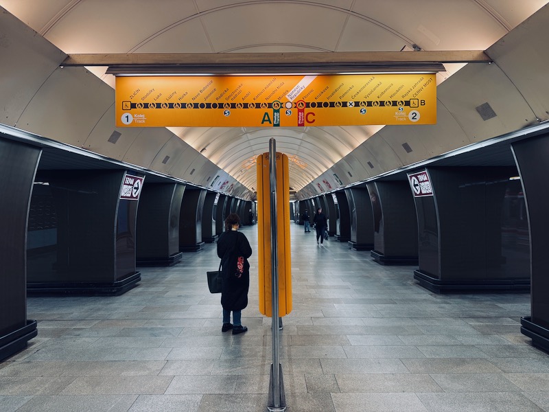 a person standing in a subway station