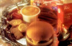 a hamburger and cookies on a tray
