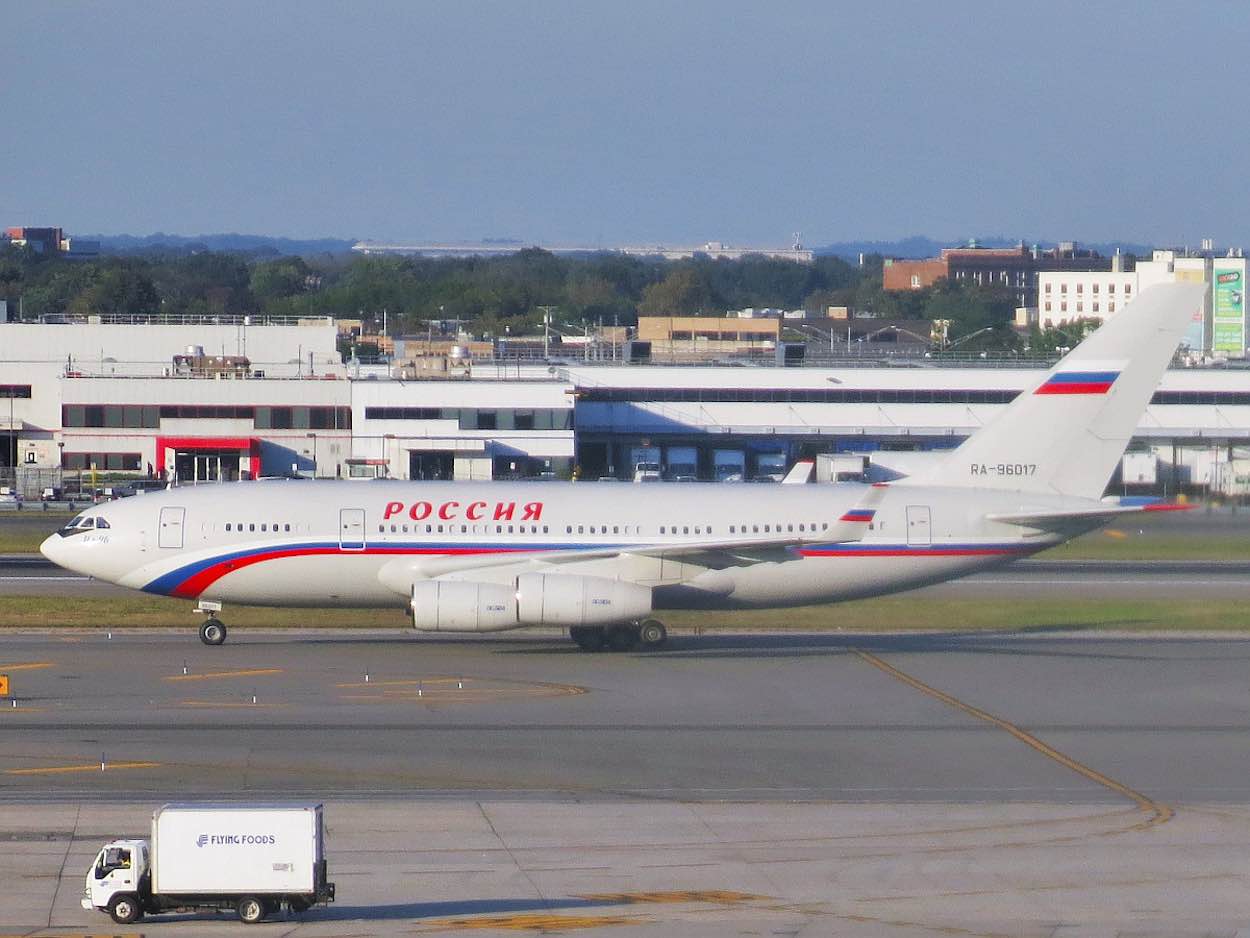 a white airplane on the runway