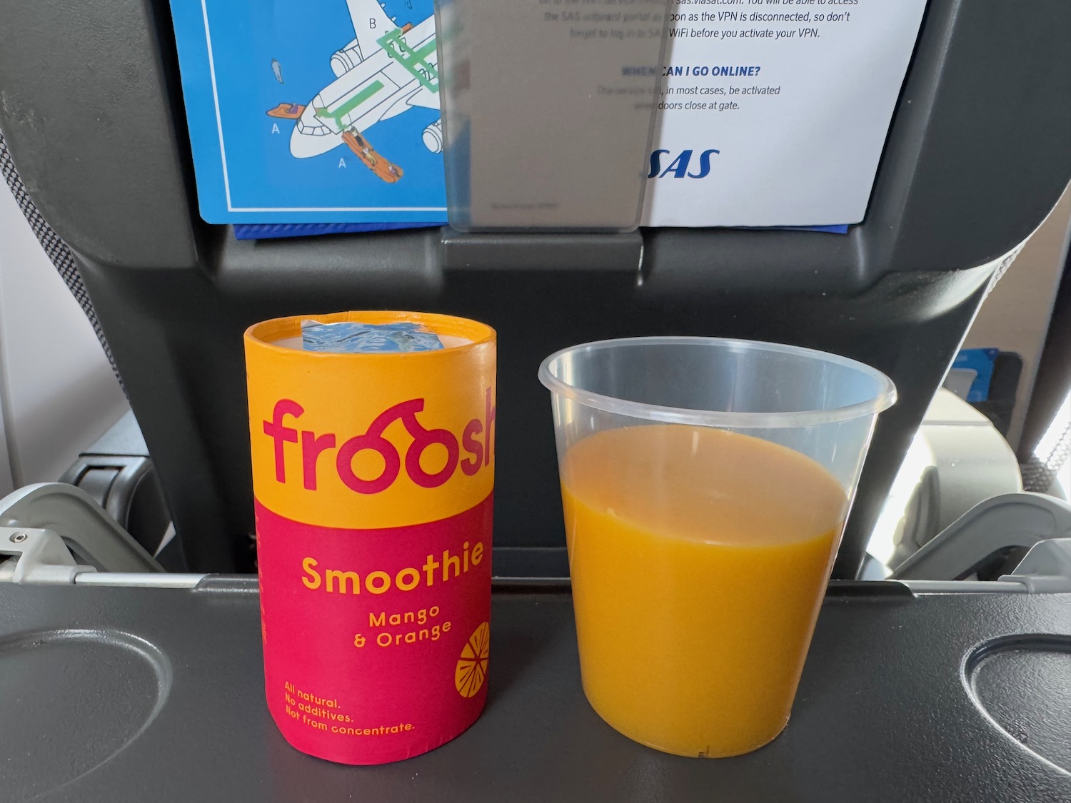 a plastic cup and a drink on a table