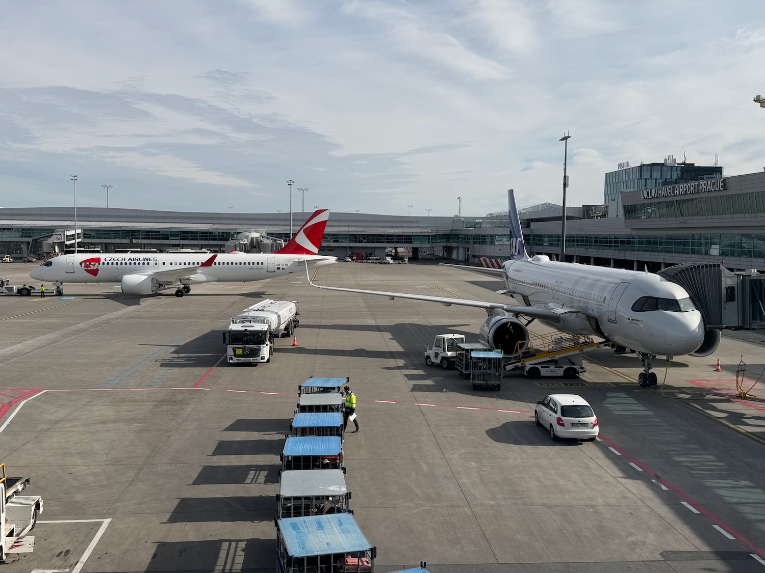 a group of airplanes at an airport