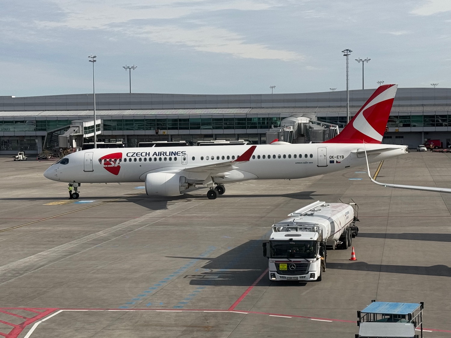 a white airplane on a runway