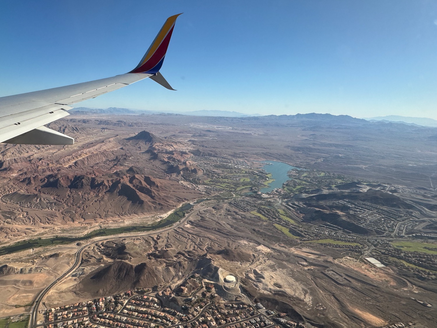 an airplane wing and landscape