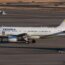 a white airplane on a runway