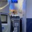 a woman in a mask on a plane