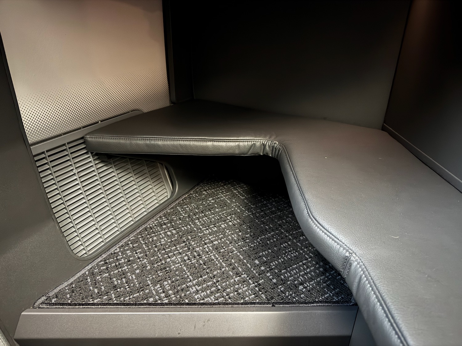 a black and grey seat with a vent