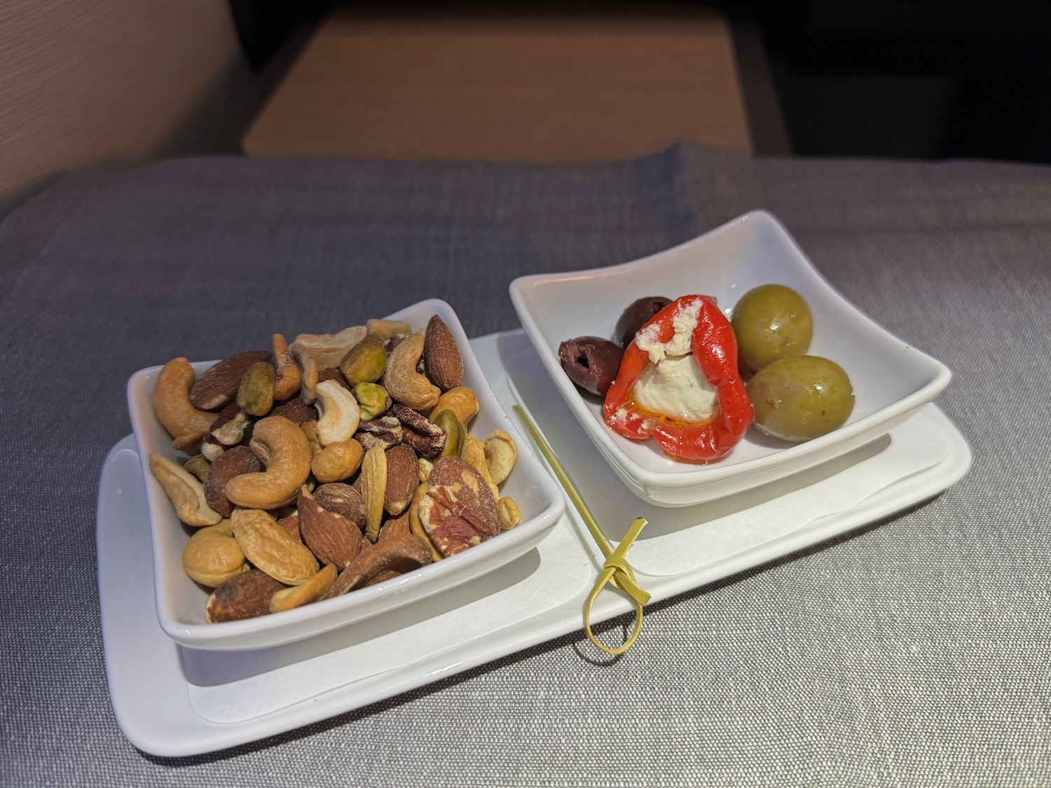 a plate of nuts and olives