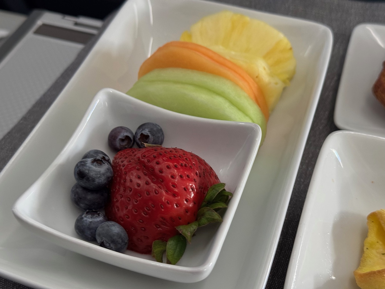 a plate of fruit on a tray