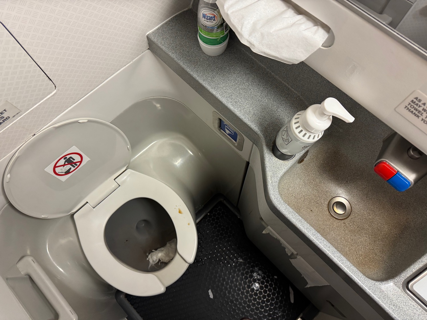a toilet and sink in a bathroom