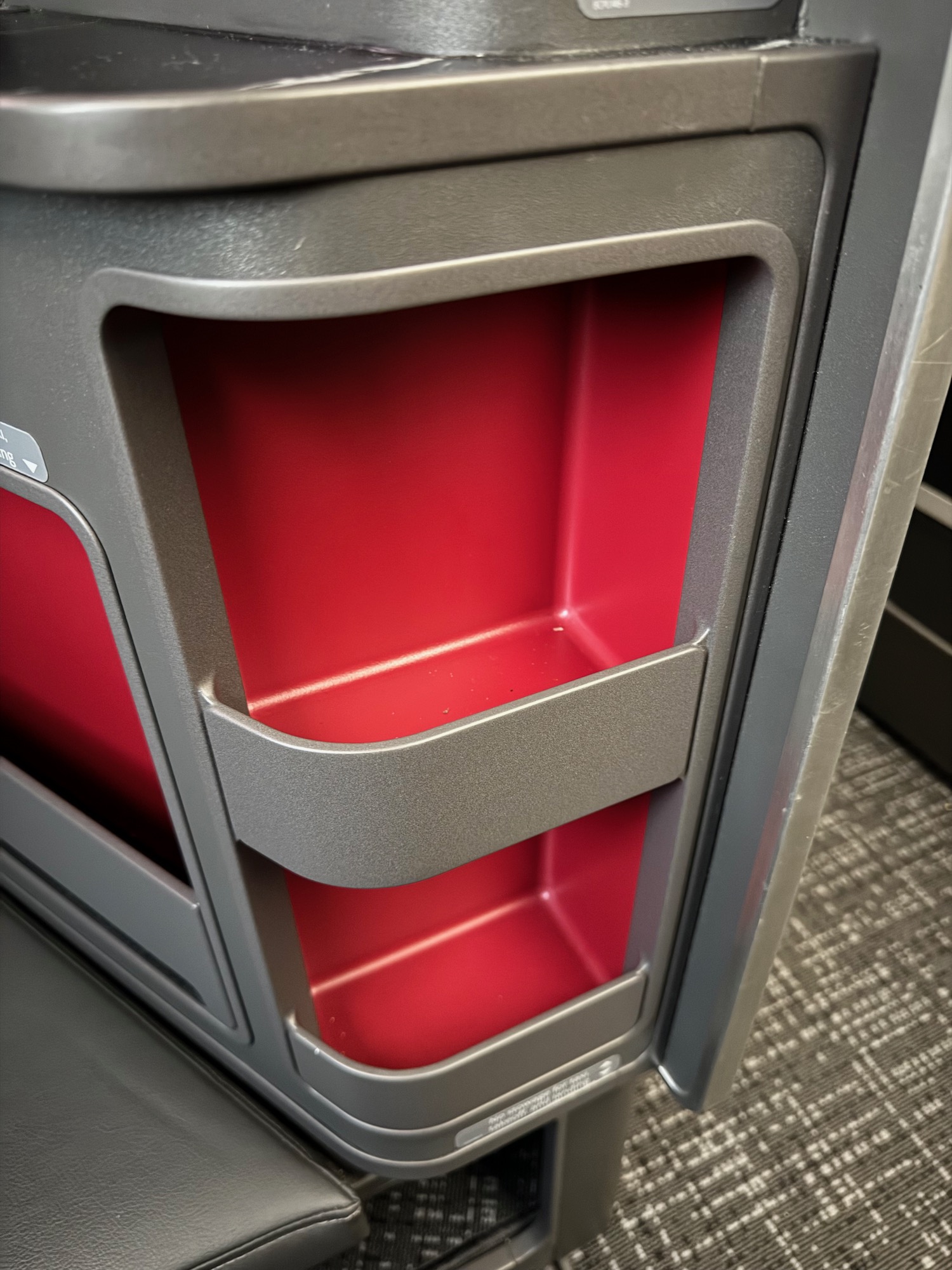 a red and grey object with a red interior