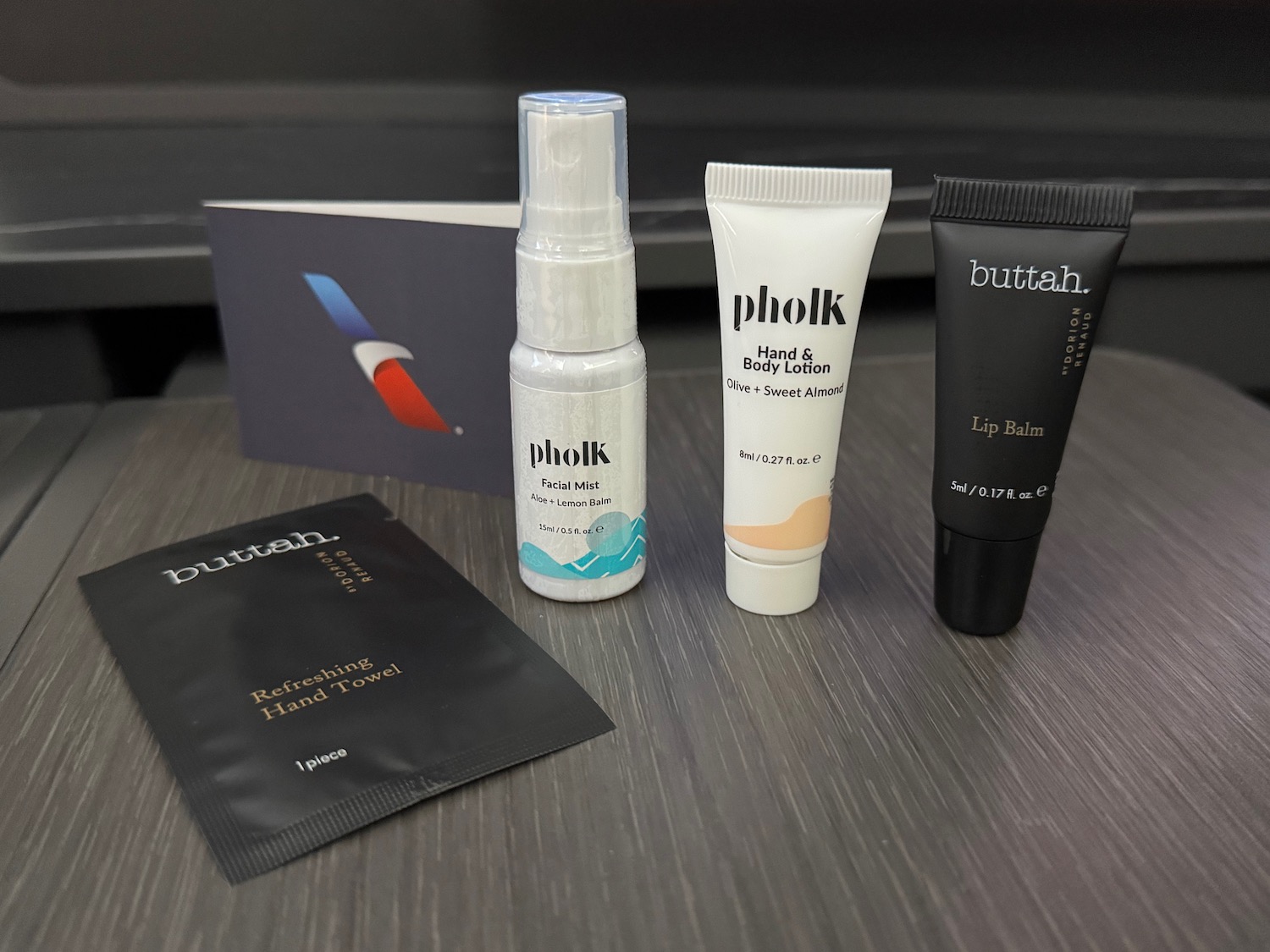 a group of small bottles of cosmetics