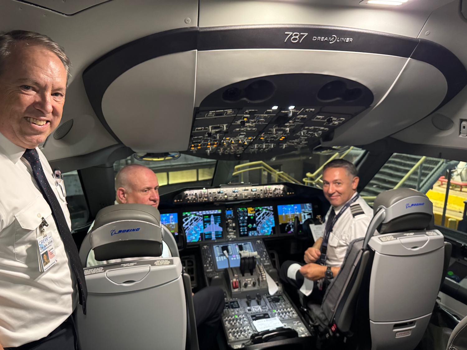 a group of men in a cockpit of an airplane
