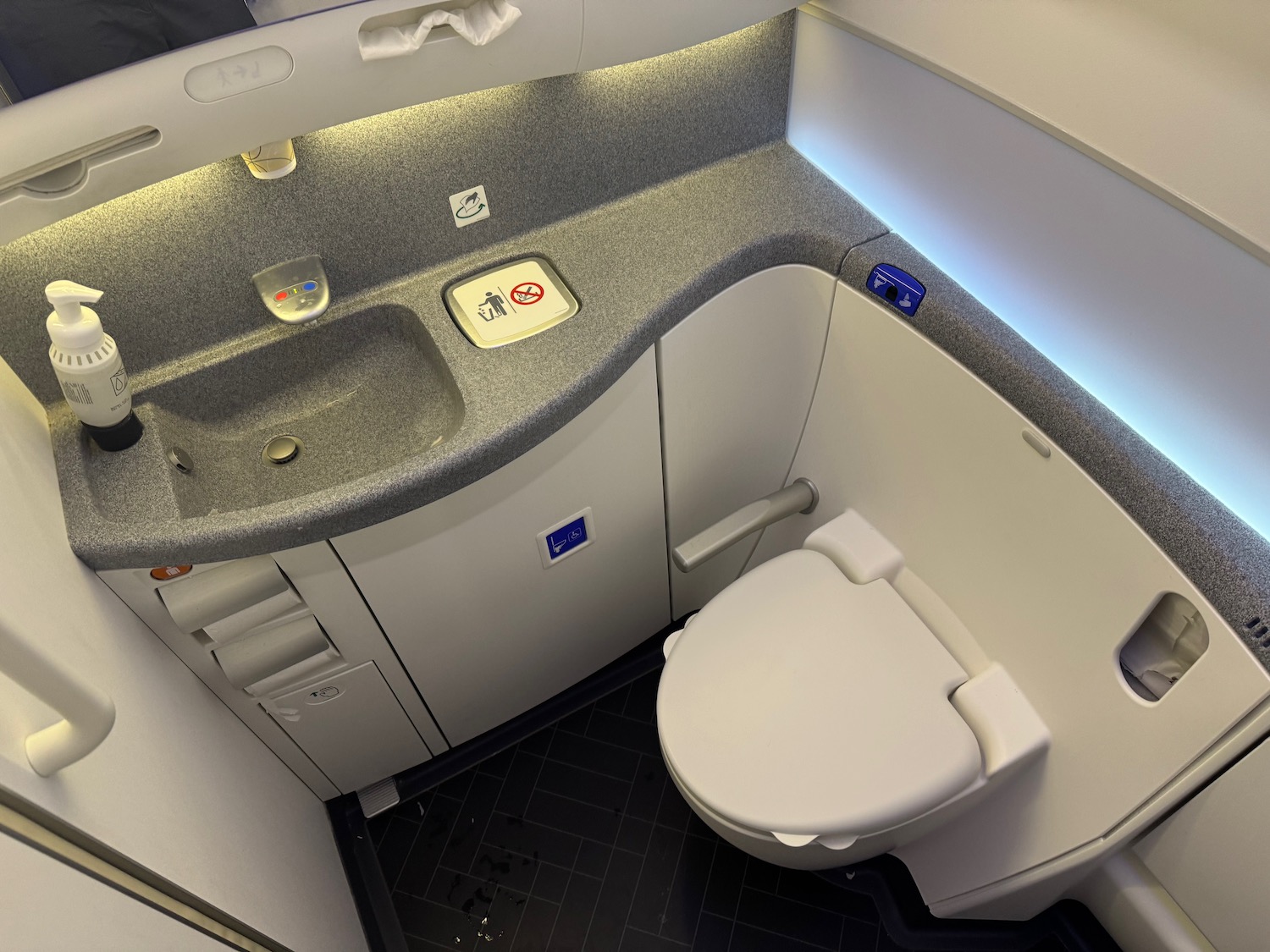 a toilet and sink in a bathroom