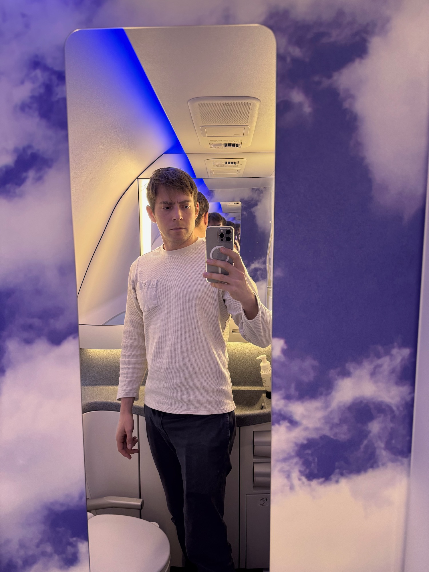 a man taking a selfie in a plane