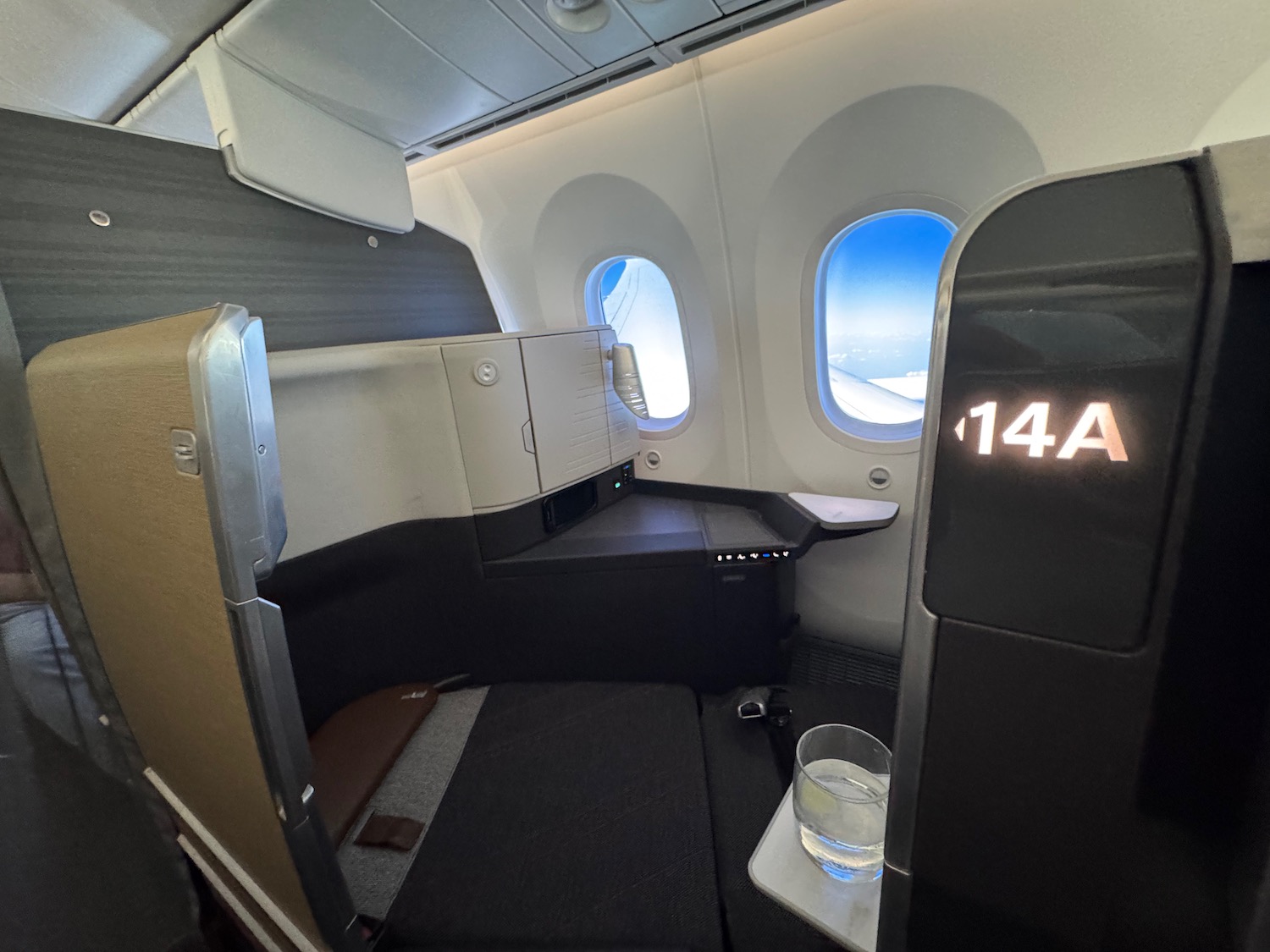 an airplane with a glass of water on the side
