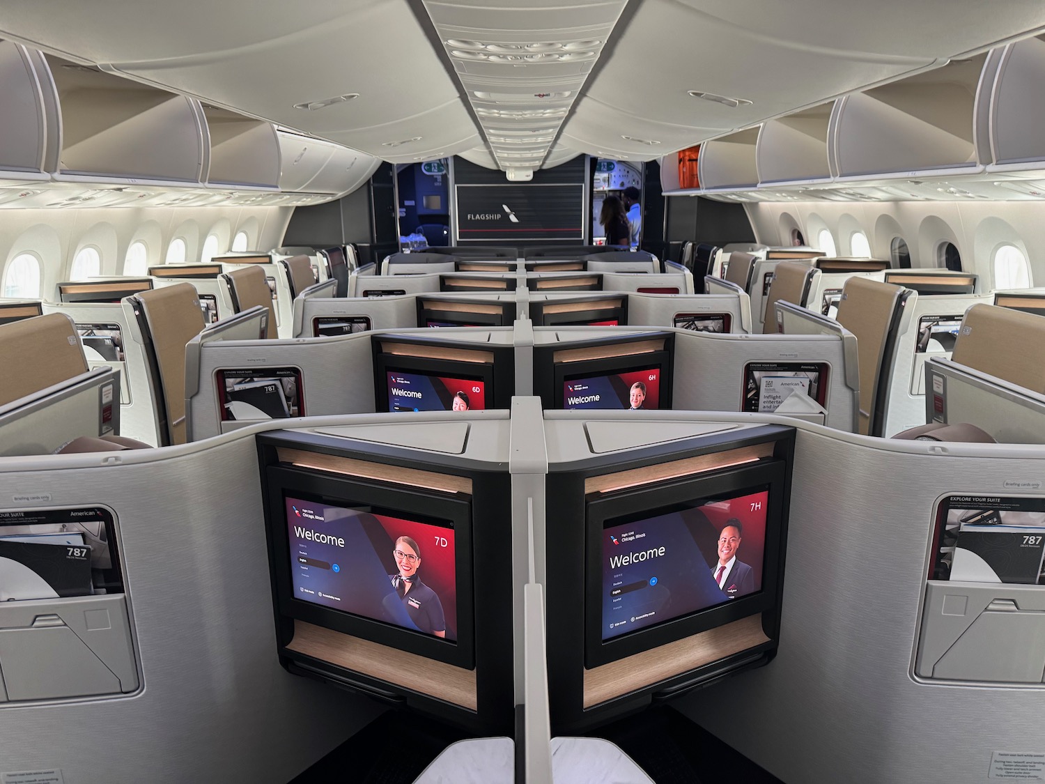 a row of monitors in an airplane