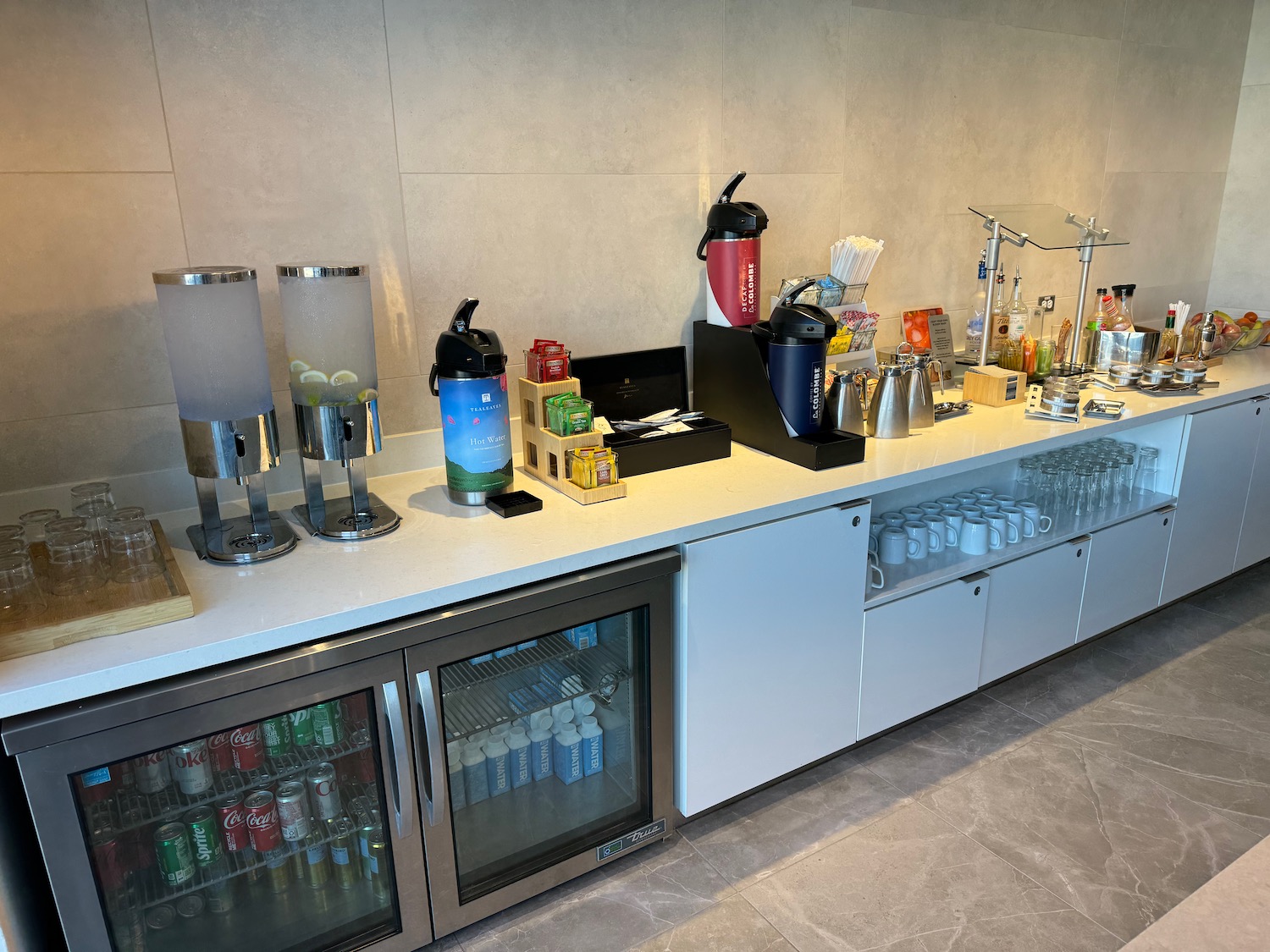 a counter with drinks and beverages on it