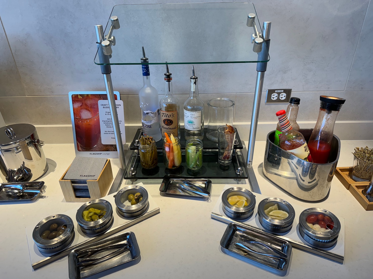 a bar with bottles of alcohol and utensils