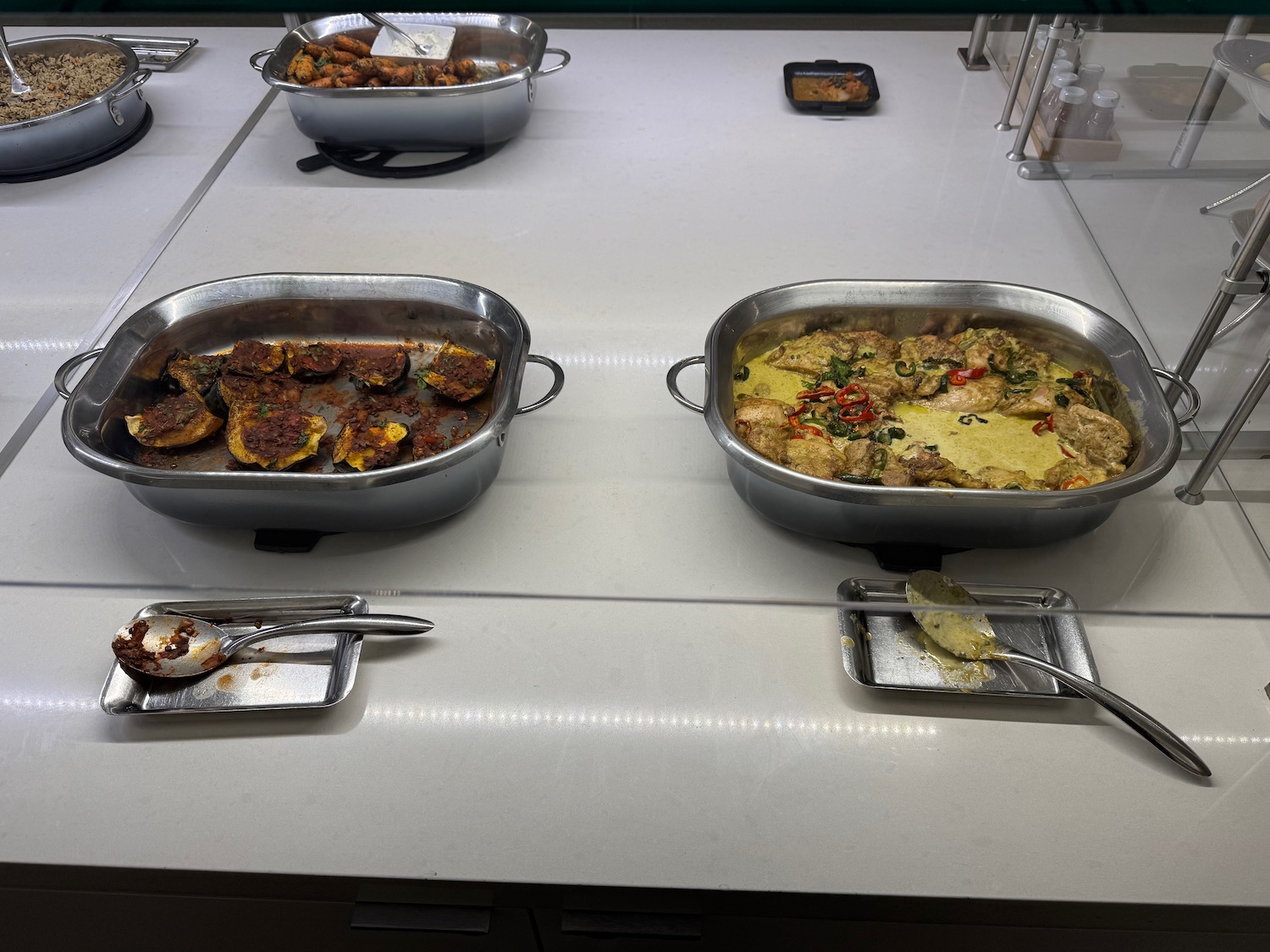 a group of pans with food in them
