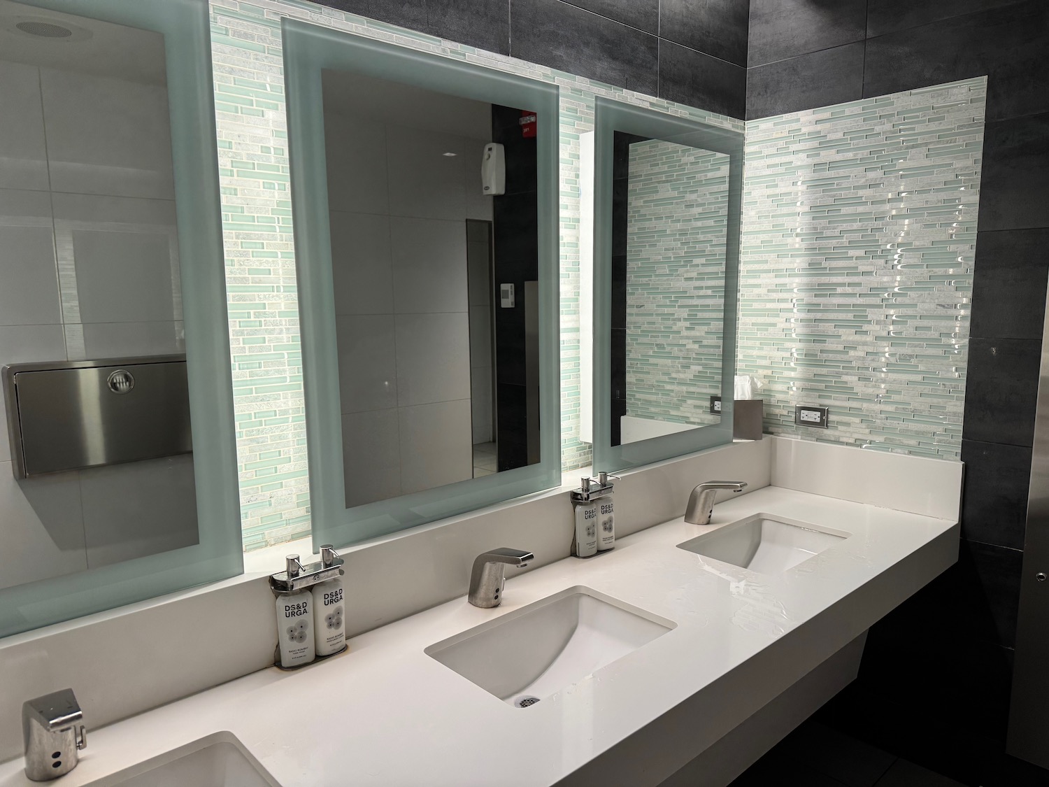 a bathroom with sinks and mirrors