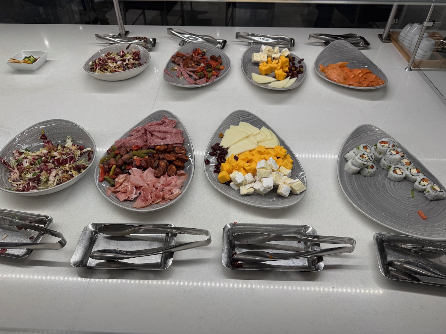a group of plates of food on a table