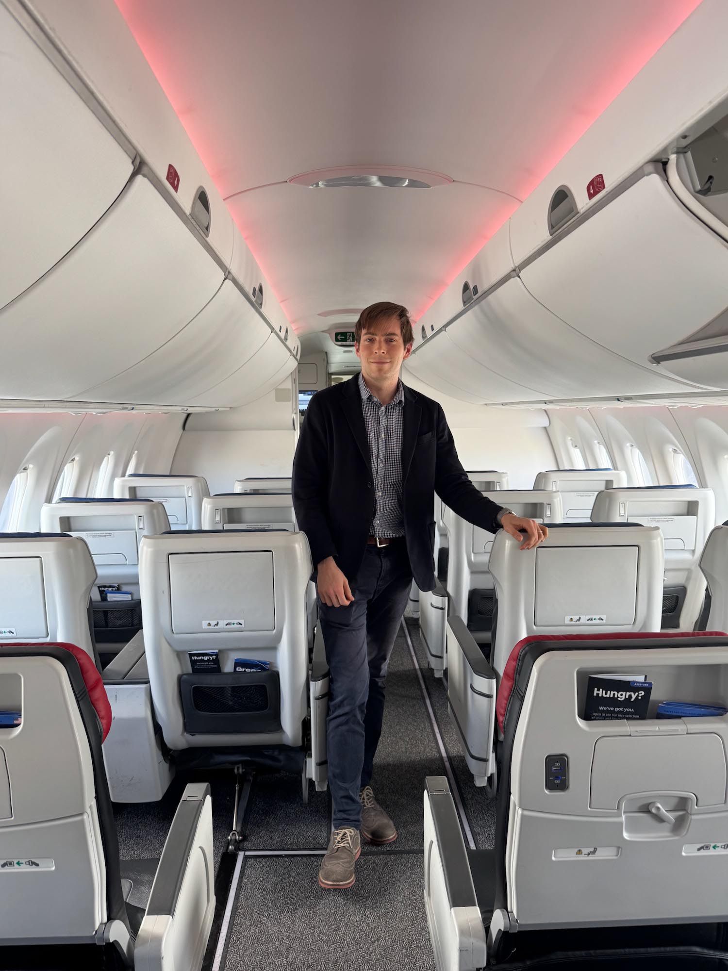 a man standing in an airplane
