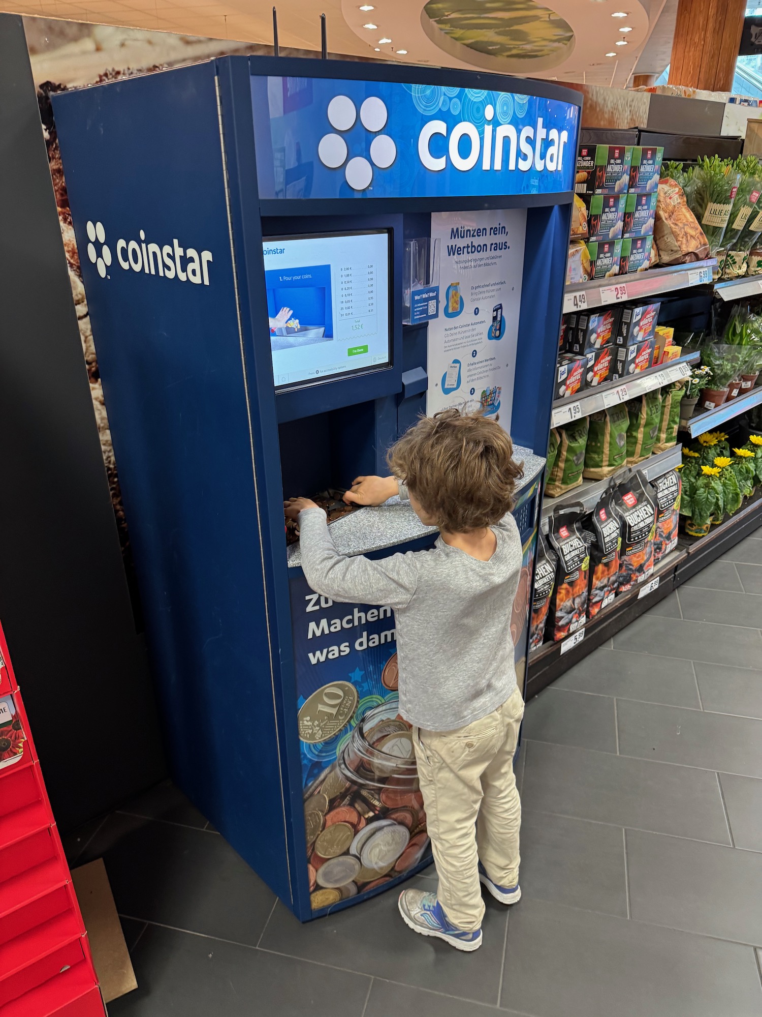a child standing at a machine