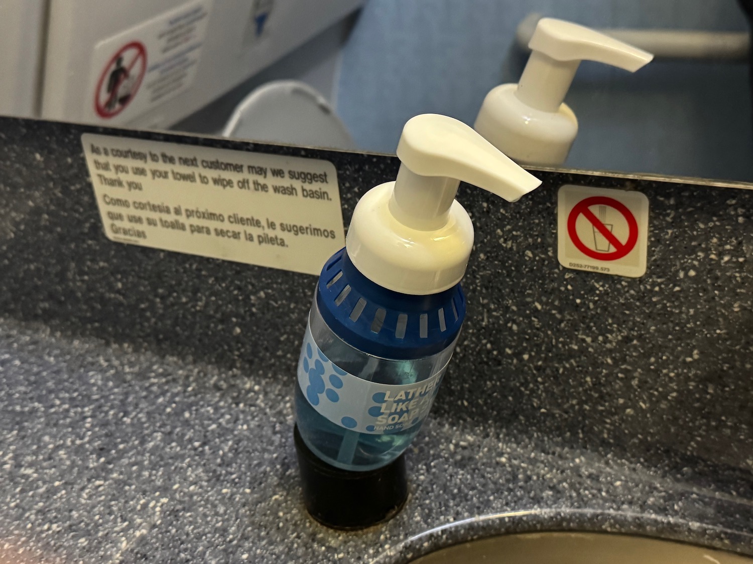a soap dispenser on a sink