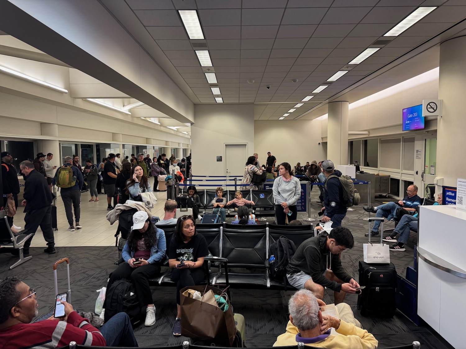 a group of people sitting in a waiting area