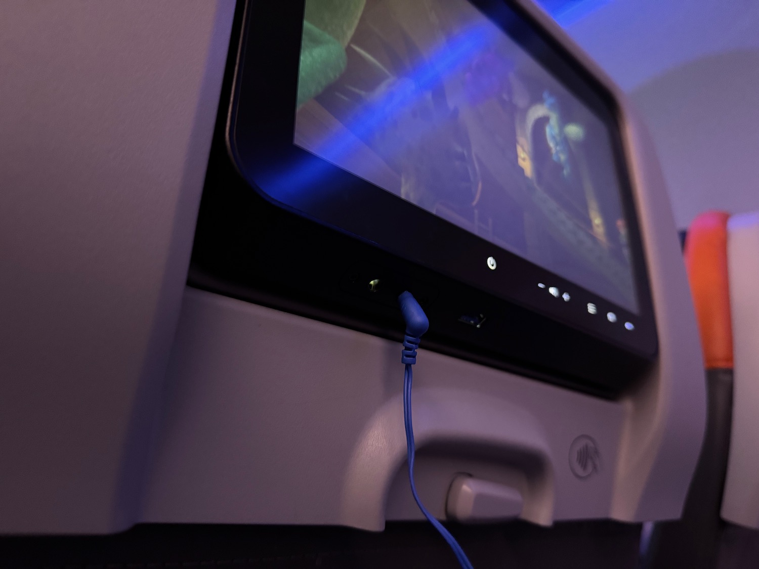 a tv with a blue cable plugged into it