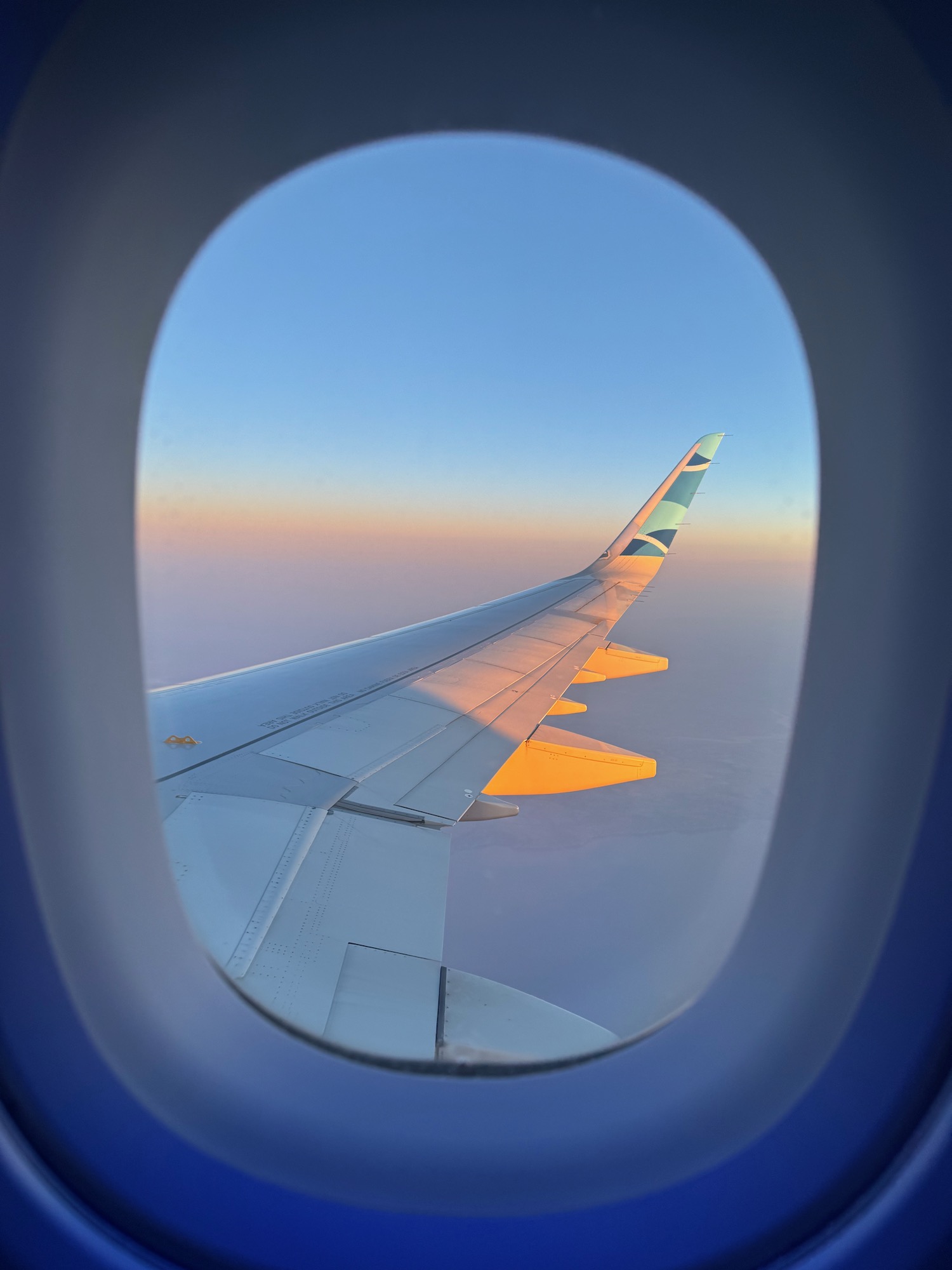 an airplane wing in the sky