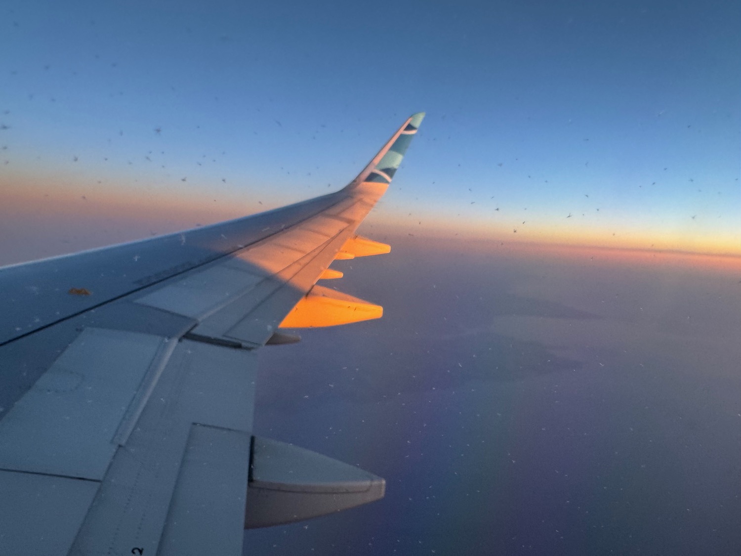 an airplane wing in the sky