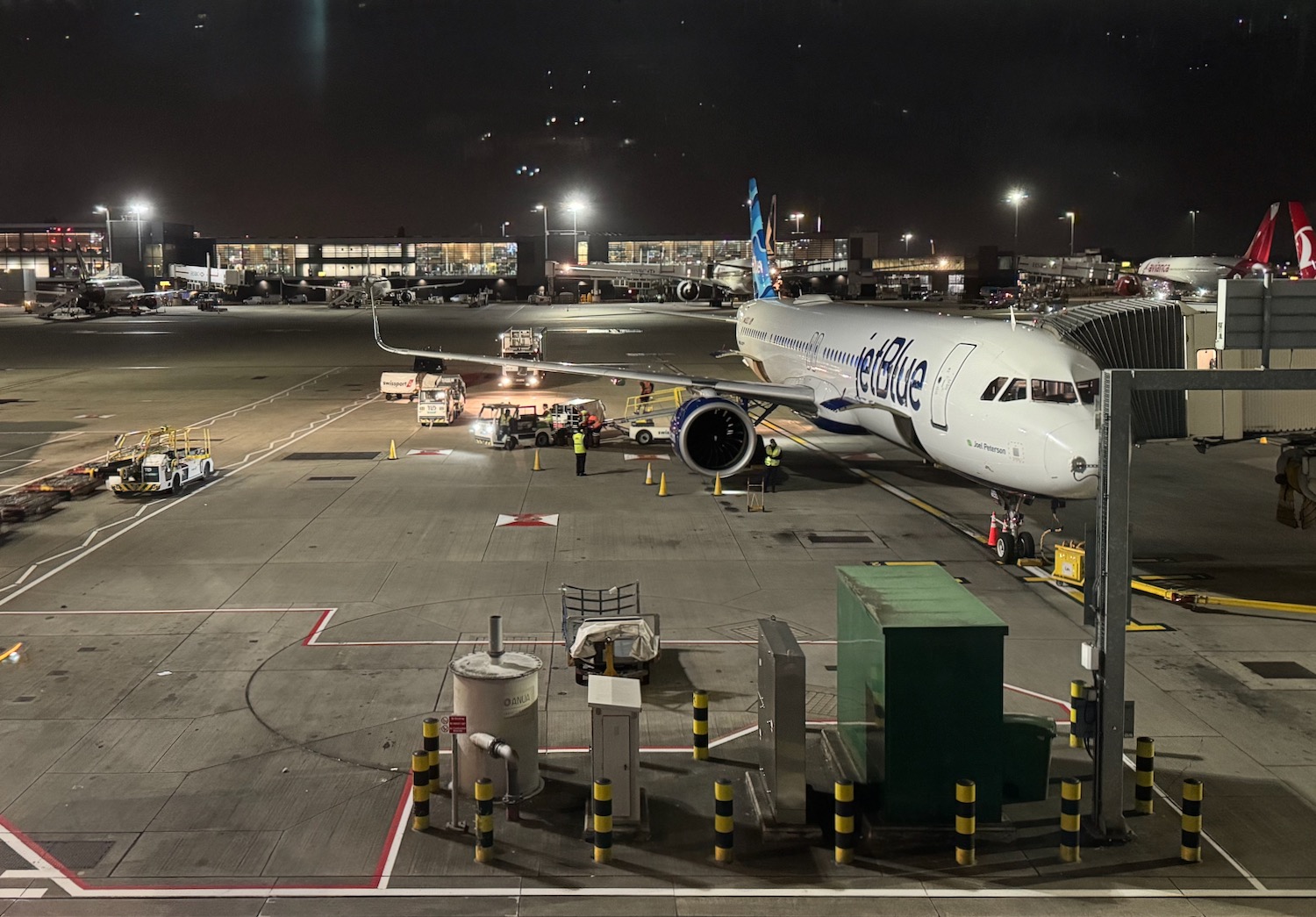 an airplane on the tarmac at night
