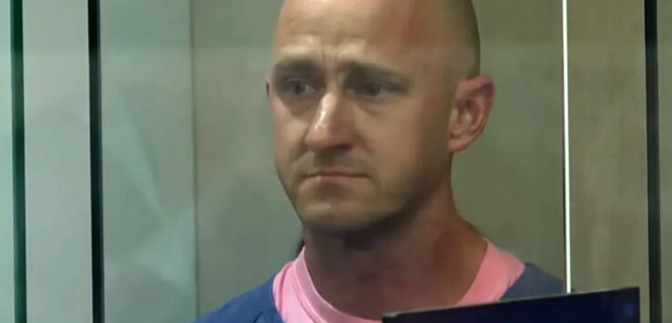 a man in a blue shirt