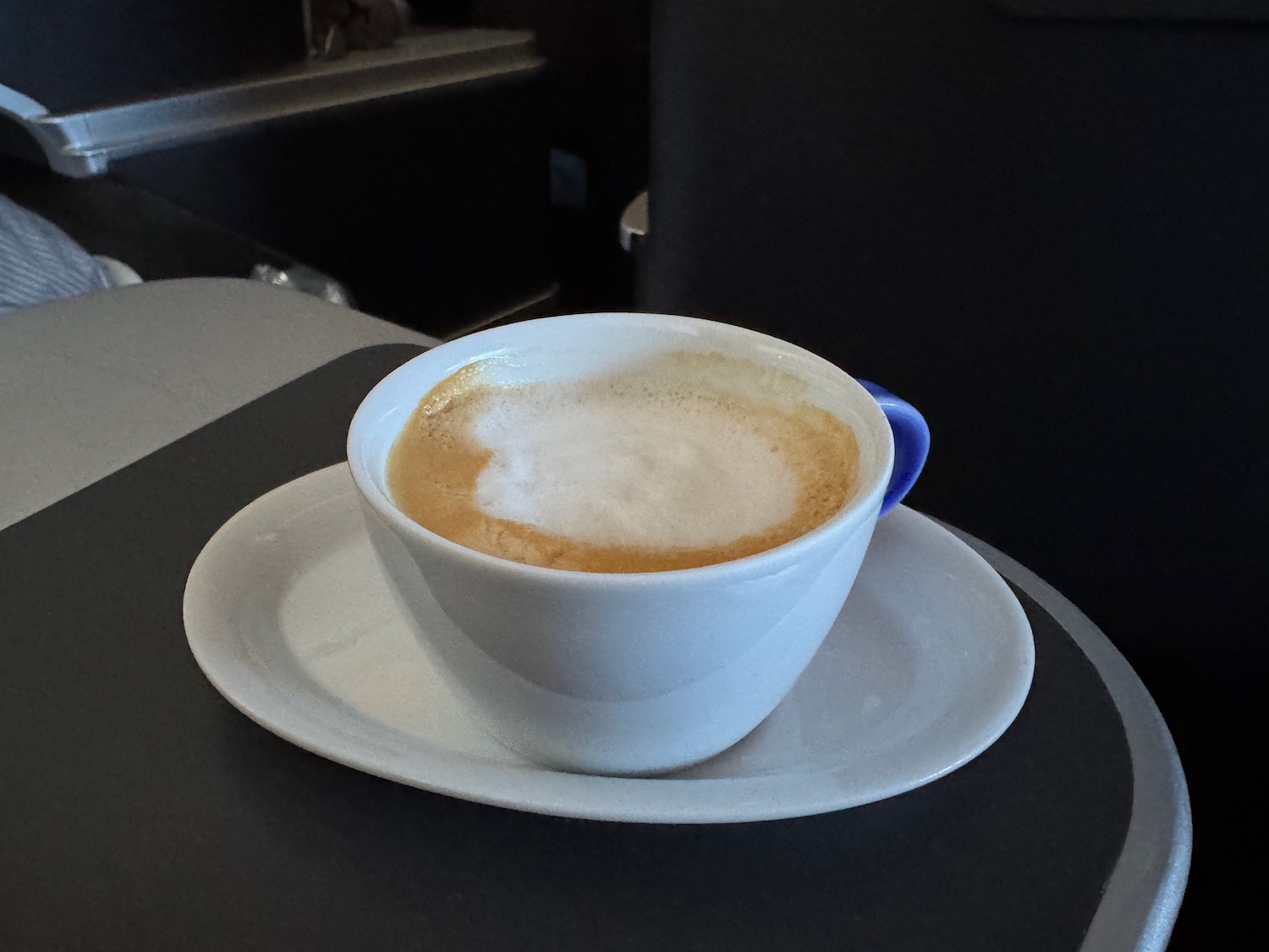 a cup of coffee on a plate