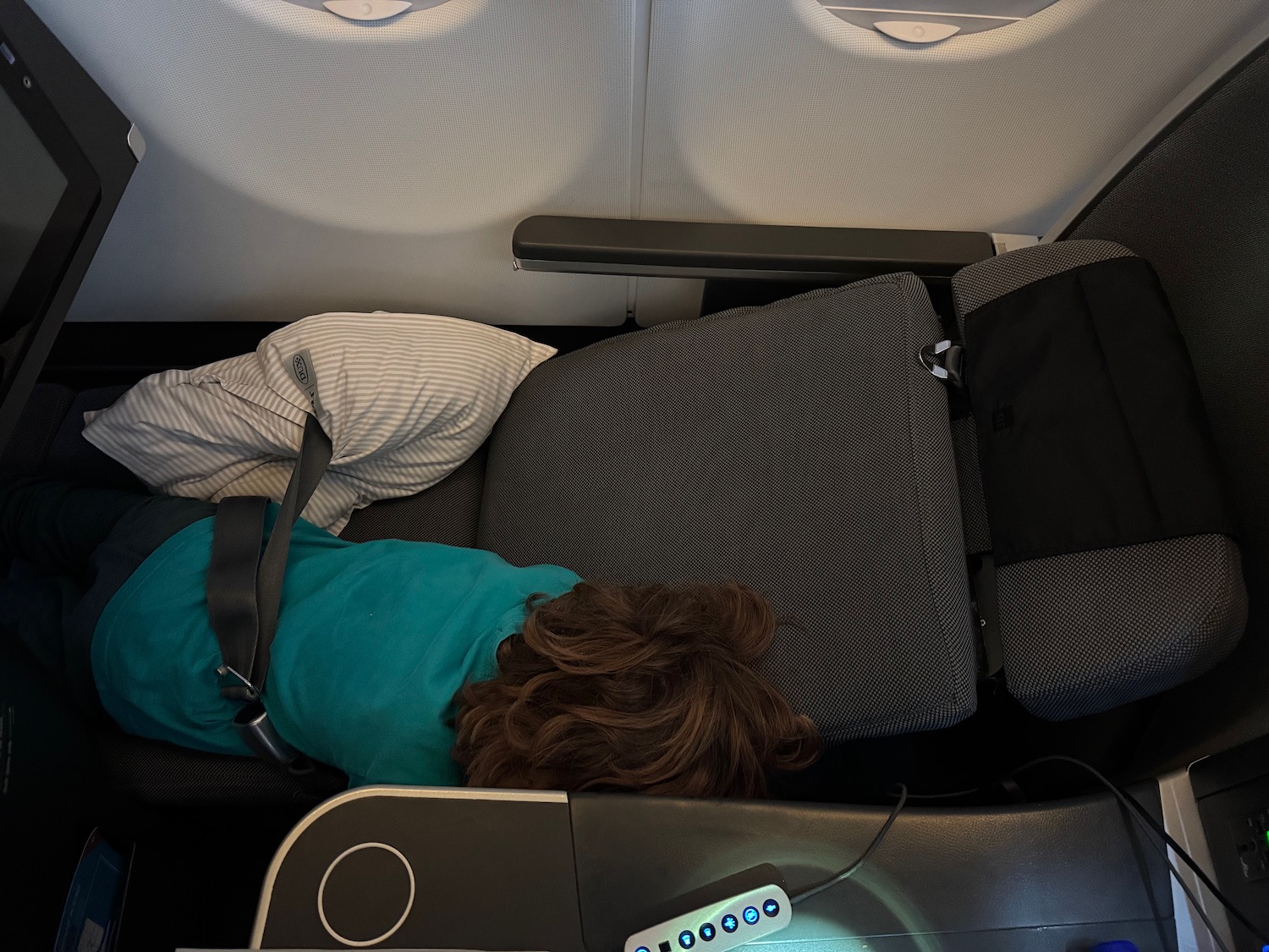 a person sleeping on a seat