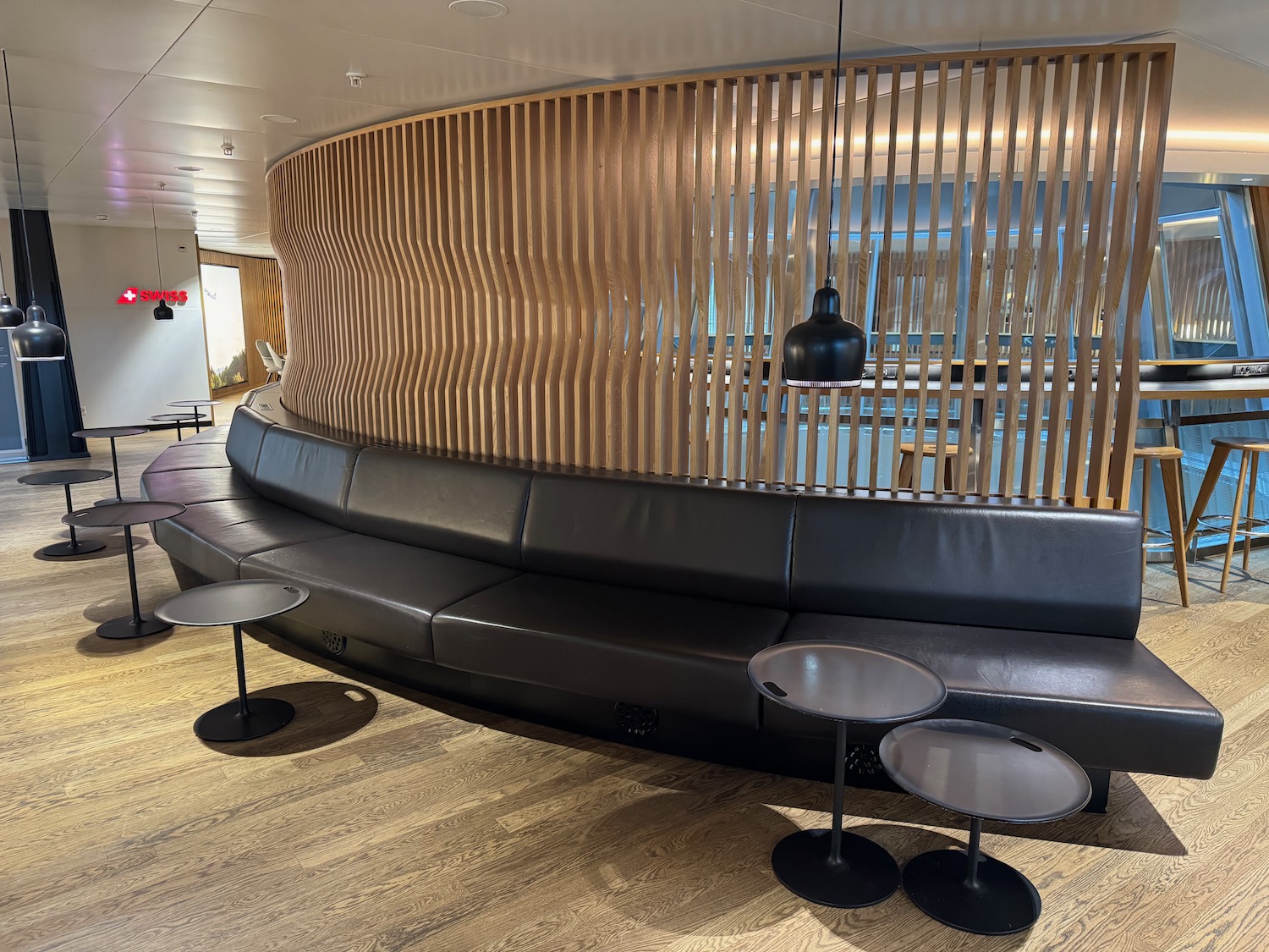 a black couch and tables in a room