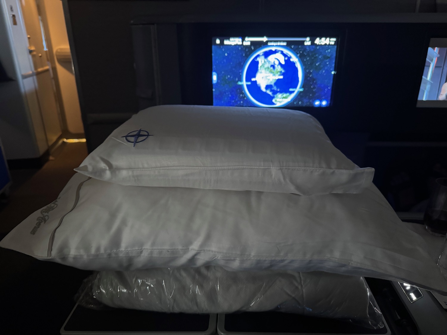 a stack of pillows on a television