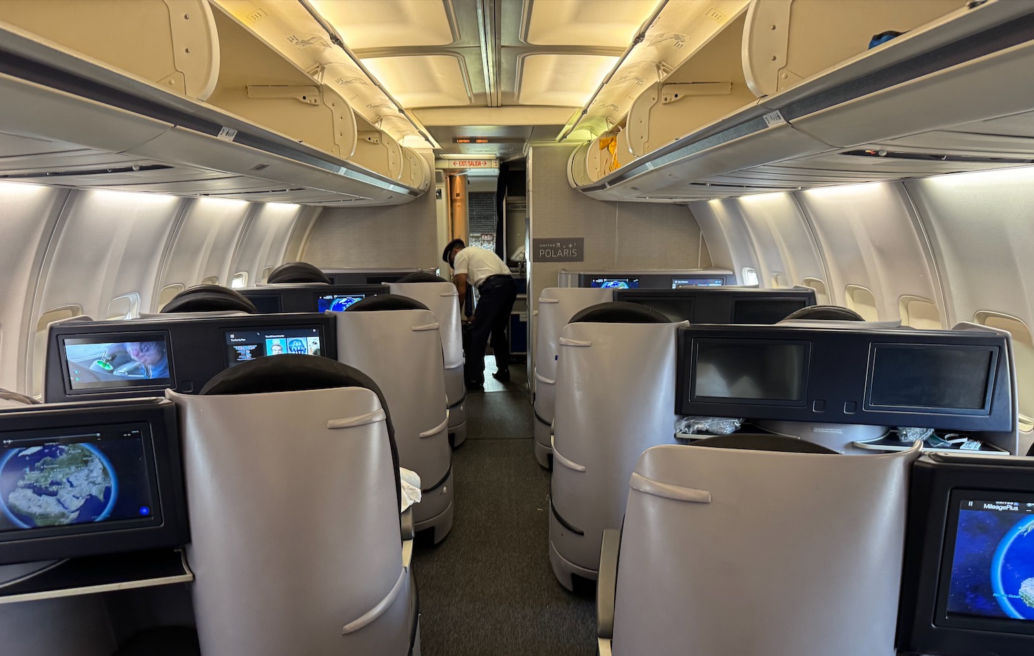 a man standing in the middle of an airplane