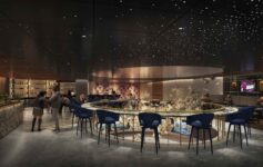a room with a bar and chairs