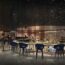 a room with a bar and chairs