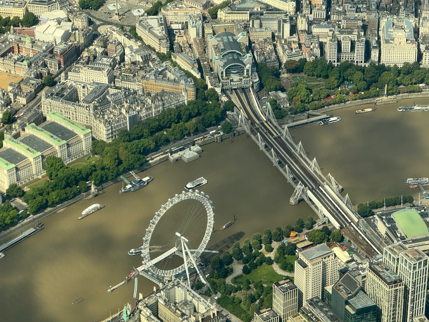 a bridge over a river with a ferris wheel