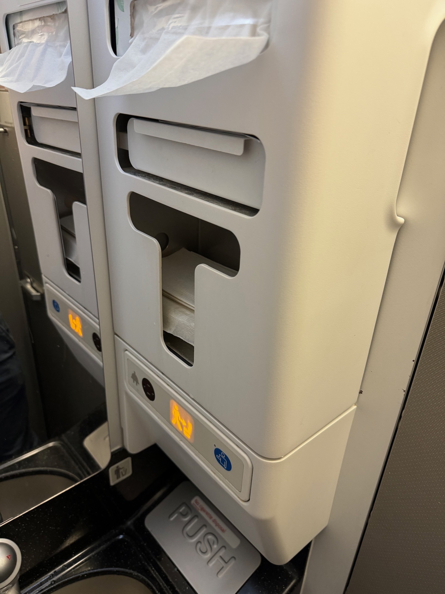 a toilet paper dispenser on a plane