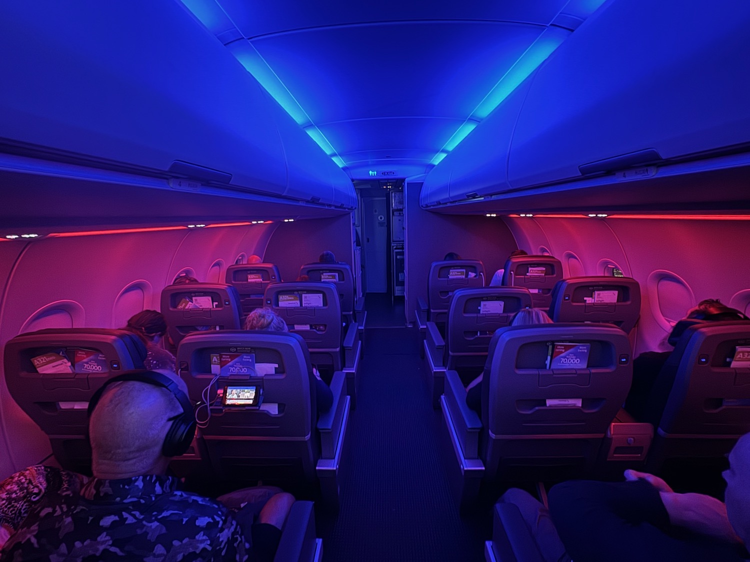 a group of people sitting in an airplane