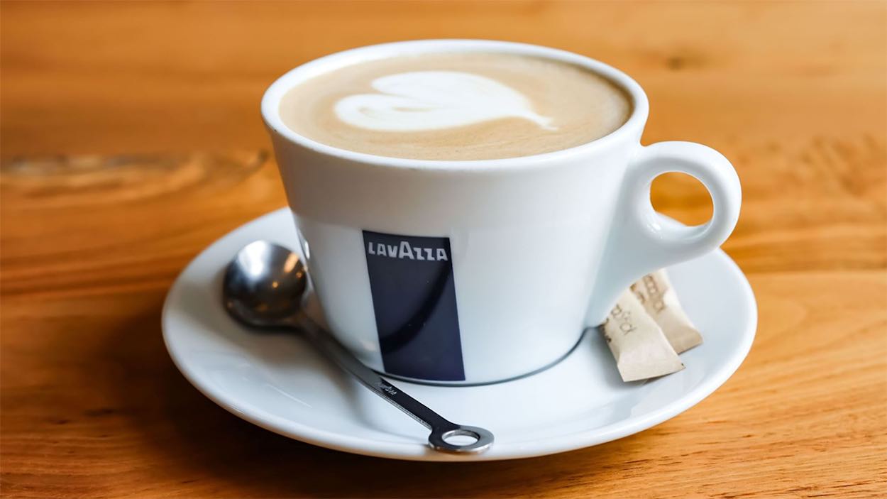 a cup of coffee with a heart design on top of it